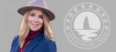 Headshot of Council member Cindi Horne in a blue coat and brimmed hat.